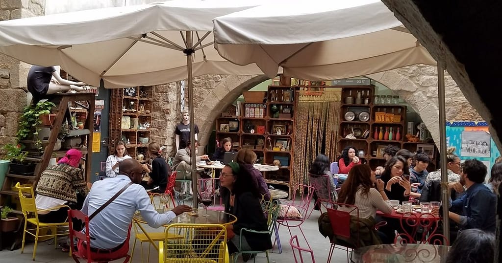 Diners chatting in a cozy café: the Mediterranean diet in Spain is as much about healthy eating as it is about socializing