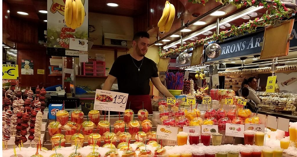 Fruits and vegetables are staples of healthy Spanish food, as one can see at a Barcelona market fruit salad bar    