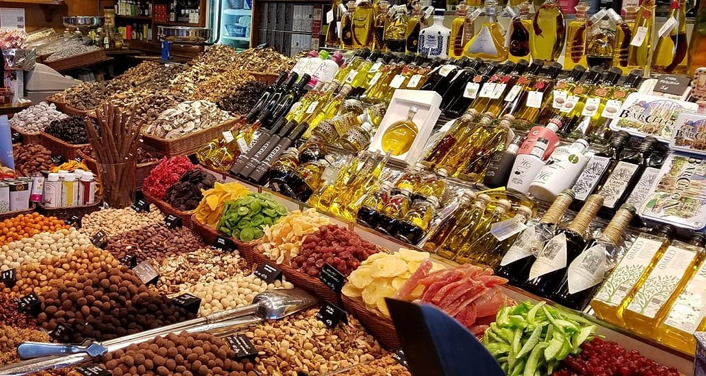 A wide selection of nuts and olive oils in a Barcelona shop is typical of healthy Spanish food choices 