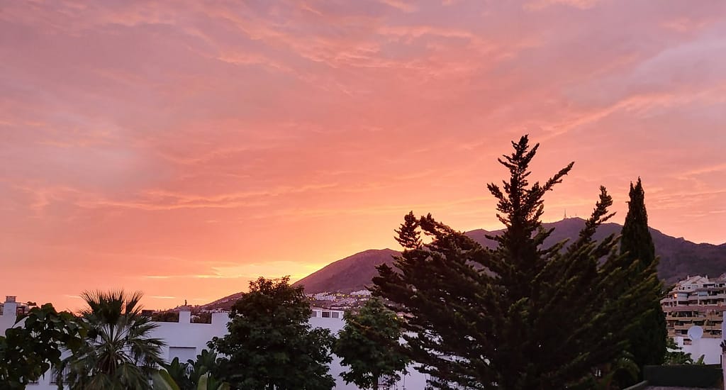 Picturesque rose-colored sunset over the mountain is typical of Benalmadena's scenic views