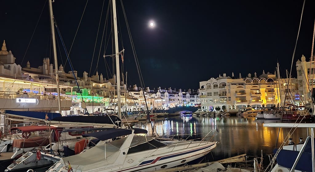 Brightly lit up during the night, Puerto Marina is a popular place to enjoy scenic views