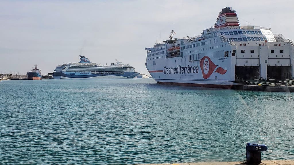 Trasmediterranea ferry ship and a cruise liner docked in Malaga seaport