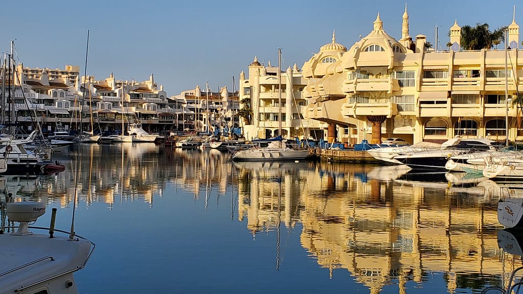 Lit up by the sun, uniquely designed houses in the marina are reflected in the water creating gorgeous scenic views