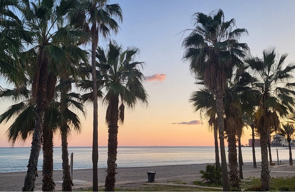 Sunset over the bay of Benalmadena, known among the best beach towns in Spain