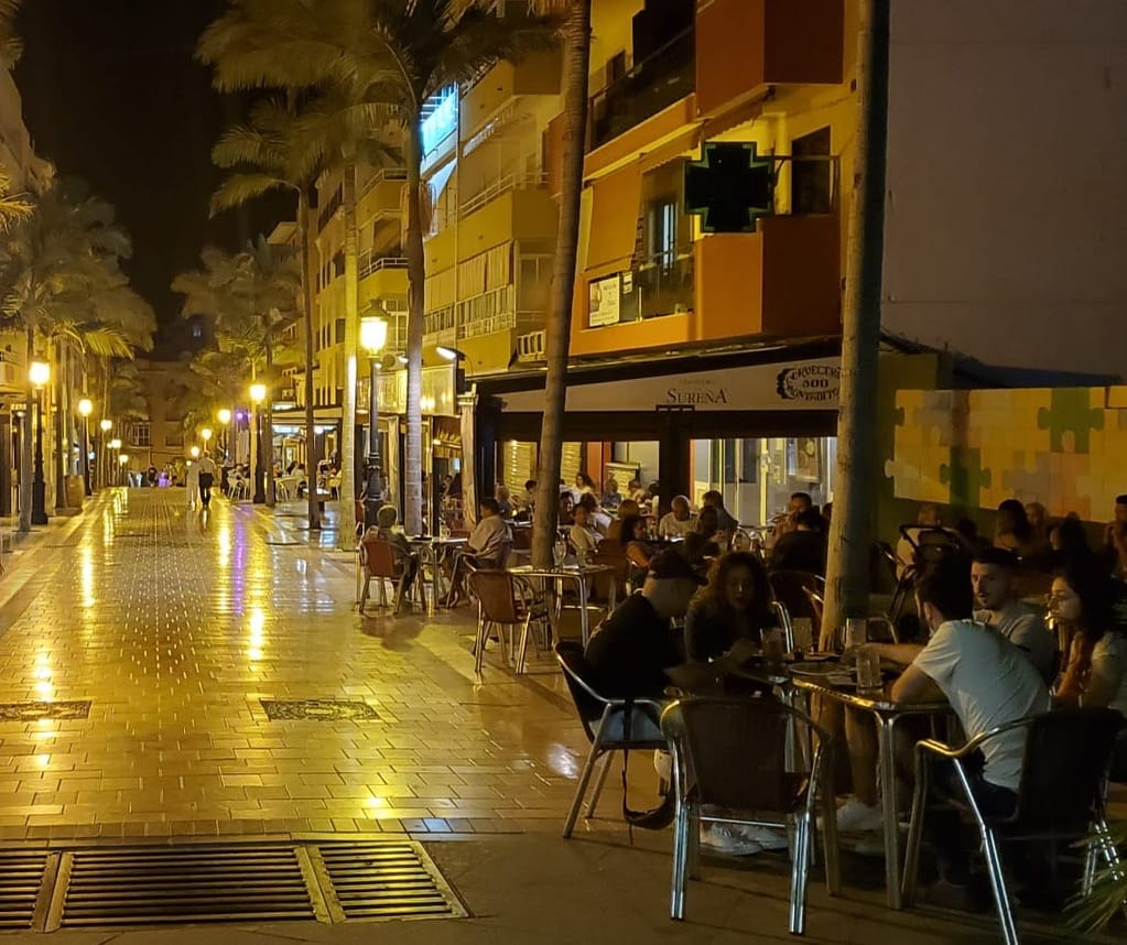 Night life in Benelamadena's popular pedestrian area with busy outdoor restaurants 