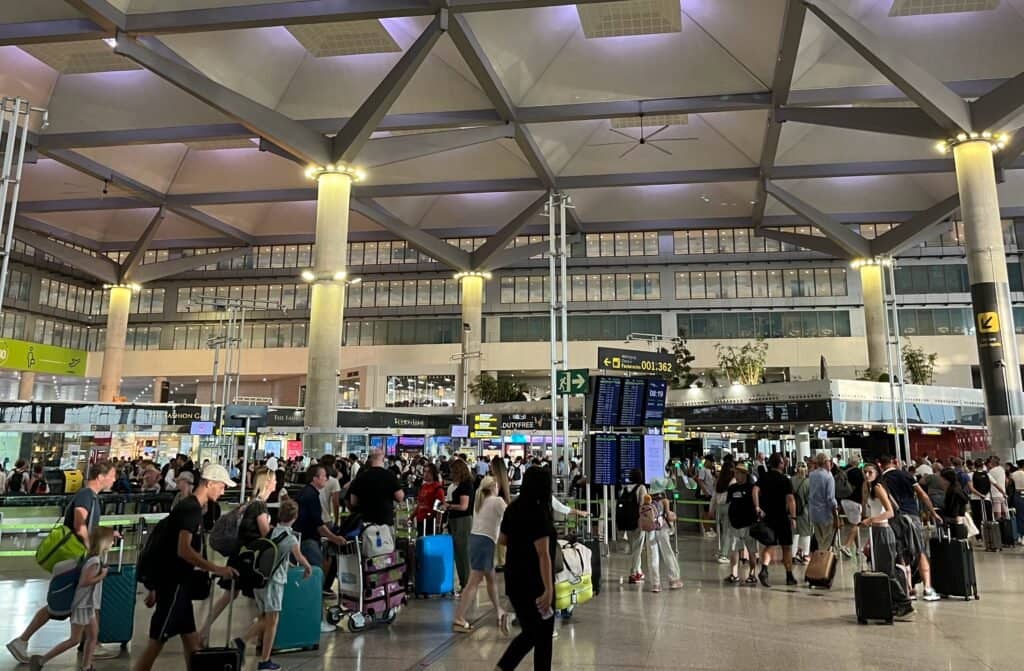 Passengers at the airport in Malaga, where opportunities for remote jobs are expanding.